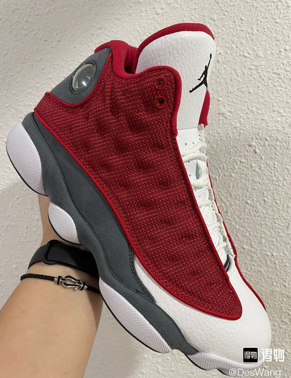 Air Jordan 13 Retro "Red Flint" sneakers in a gym red and flint grey