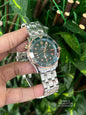 Omega Seamaster Diver 300M in grade 2 titanium and bronze gold with a green dial.