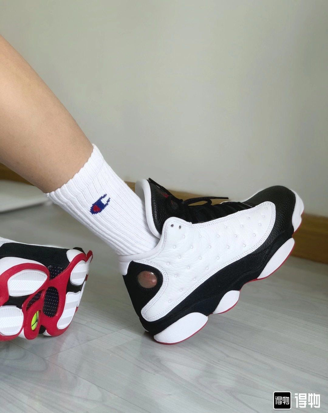 Air Jordan 13 Retro "He Got Game" sneakers in a white, black, and red