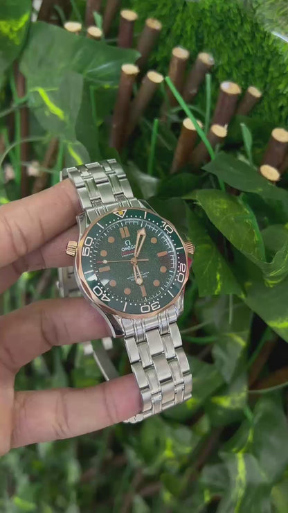 Omega Seamaster Diver 300M in grade 2 titanium and bronze gold with a green dial.